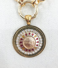 Load image into Gallery viewer, This vintage Chanel button is a rare find, featuring gold and red coloring detailing with slight Chanel wording in the center. The piece features a gleaming gold-plated rolo chain, paired with a base adorned with dazzling clear crystals, creating a stunning and attention-grabbing appearance.
