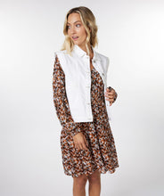 Load image into Gallery viewer, Meet the modern essential: this crisp off-white denim vest by EsQualo adds structure, style, and versatility to any summer look. With its clean tailoring and cropped silhouette, it’s the perfect piece to pop over sundresses, tanks, or tonal denim for a look that’s effortlessly elevated. Light, breezy, and endlessly chic—this gilet is your go-to for warm days and cool nights.
