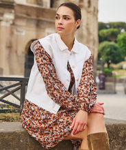 Load image into Gallery viewer, Meet the modern essential: this crisp off-white denim vest by EsQualo adds structure, style, and versatility to any summer look. With its clean tailoring and cropped silhouette, it’s the perfect piece to pop over sundresses, tanks, or tonal denim for a look that’s effortlessly elevated. Light, breezy, and endlessly chic—this gilet is your go-to for warm days and cool nights.
