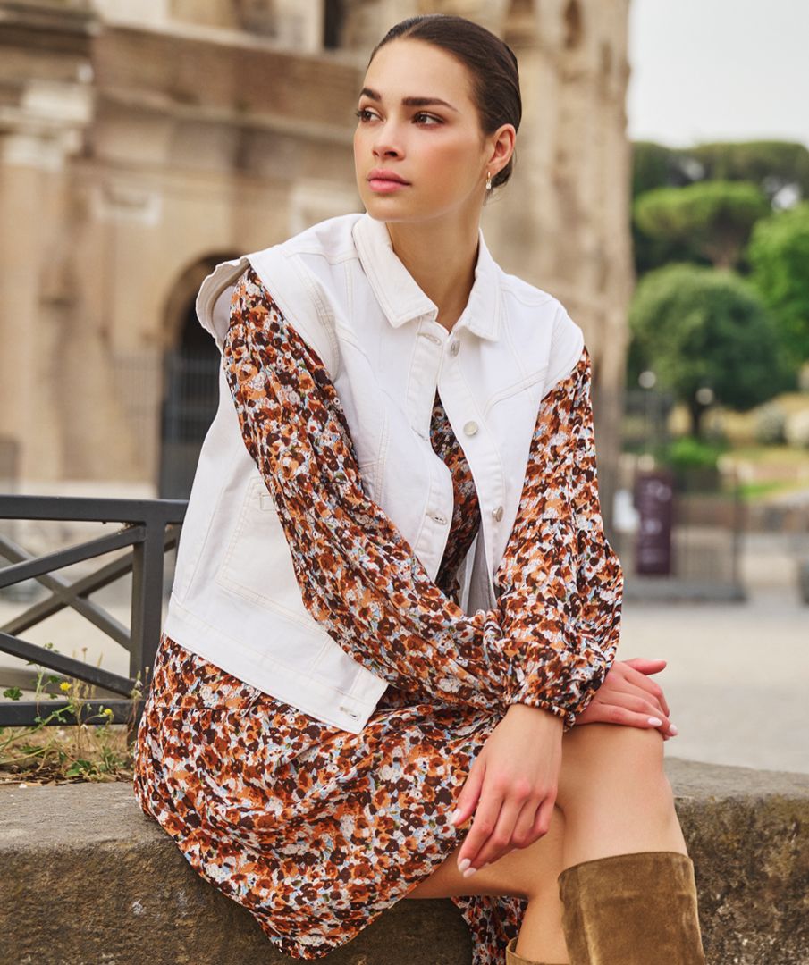 Meet the modern essential: this crisp off-white denim vest by EsQualo adds structure, style, and versatility to any summer look. With its clean tailoring and cropped silhouette, it’s the perfect piece to pop over sundresses, tanks, or tonal denim for a look that’s effortlessly elevated. Light, breezy, and endlessly chic—this gilet is your go-to for warm days and cool nights.