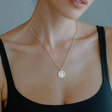 Load image into Gallery viewer, This exquisite necklace is crafted by hand and features a dainty Saint Christopher charm elegantly hanging from an 18-inch rope chain.
