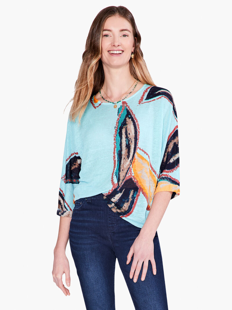 An eye-catching print that speaks to nature and time spent outdoors, printed on top of our feather knit fabric, a super comfortable linen blend. This pullover top features a modern, relaxed fit, a widened boat neck, generous dolman sleeves that reach to the elbow, and a hem that sits at the hip.  Color-Aqua Multi. Pullover sweater. Lightweight. Relaxed fit. Boatneck. Elbow sleeve.