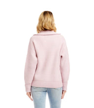 Load image into Gallery viewer, Woman wearing a pink half-zip sweater and light blue jeans against a white background.

