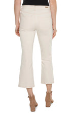 Load image into Gallery viewer, Model wearing a tan crop jean, black top and brown sandals against a white background.
