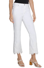 Load image into Gallery viewer, Model wearing black top, white lace detail denim and sandals against a white background.
