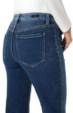 Load image into Gallery viewer, Close up of blue jean with color block striping on side against a white background.
