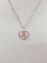 Load image into Gallery viewer, This unique piece is a valuable find. The delicate vintage CC heart zipper pull, adorned with dazzling clear crystals, adds a touch of charm in soft pink. Exude radiance and make a statement when you wear this gorgeous piece.

