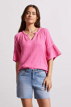 Load image into Gallery viewer, This lovely blouse is made of crinkled gauze cotton, which gives it a light and elegant touch. It features a notch neck that you can pop over, elbow-length raglan sleeves, and bell-shaped cuffs that add some playful charm.
