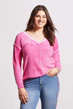 Load image into Gallery viewer, One of our top sellers, this light and adaptable V-neck sweater is a perfect choice for casual, trendy fashion.  Our gorgeous sweater offers a bright pop of pink color, pop-over design and long sleeves with drop shoulders, an exposed center seam, and a high-low hem with side-slit details.  Color - Hi pink. Pop-over v-neck. Long sleeve with drop shoulder Exposed center seam; high-low hem with side slits Special reverse bleach print Fabric - 100% Cotton.
