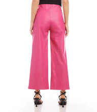 Load image into Gallery viewer, These on-trend, vegan leather trousers in a stylish hot pink hue will update your wardrobe and upgrade your look.   Color- Hot pink. Front rise: 11 3/8 inches (size M) Inseam: 26 1/4 inches (all sizes) Wide-leg. Elasticized waistband. Side zipper. Fabric -Vegan Leather: 50% Viscose. 50% Polyurethane Care- Dry clean.
