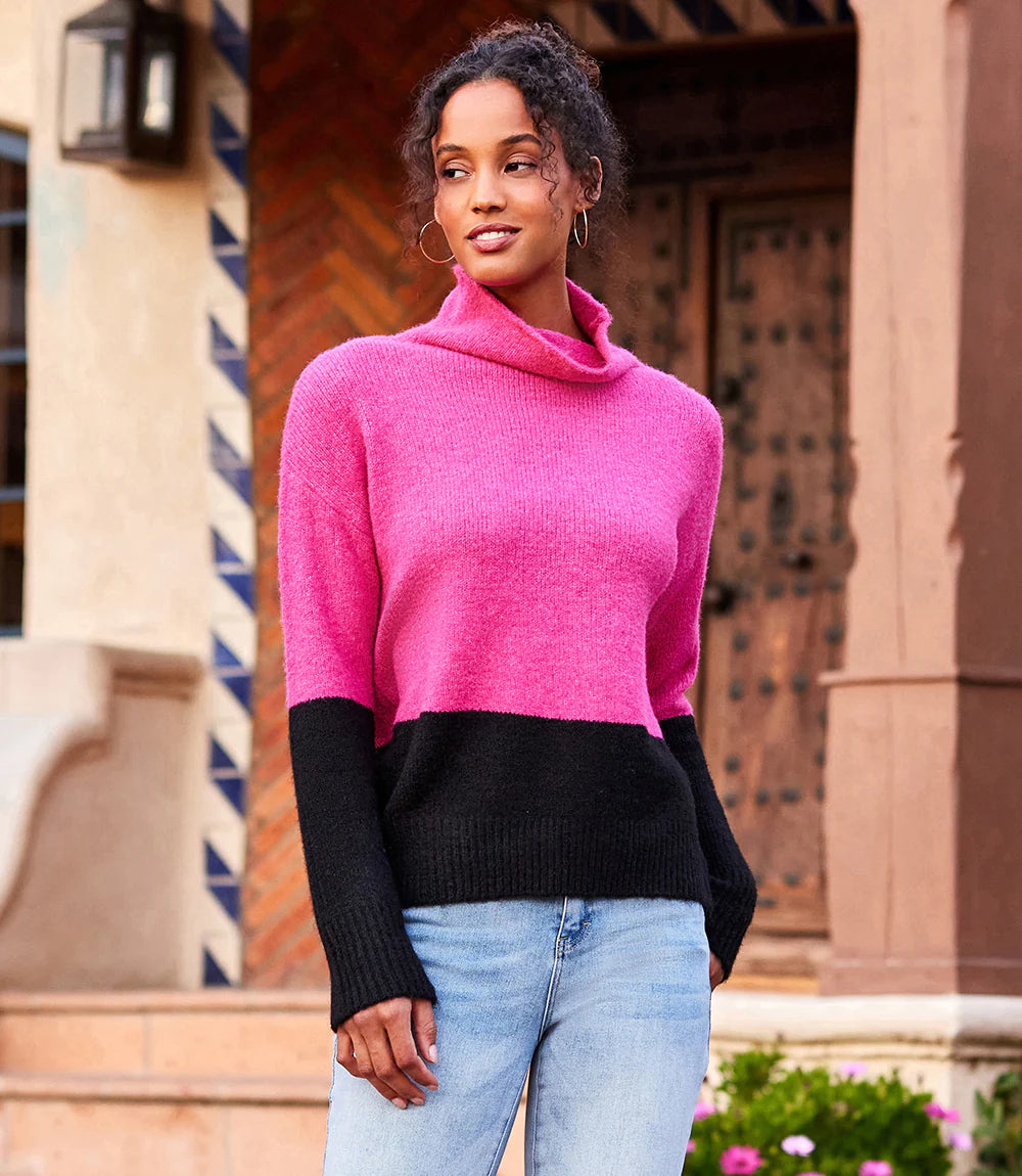 This cozy sweater helps keep out chilly weather and looks great with its hot pink and black colorblock design. Contrasting hem and sleeve detail create a sophisticated look. Color- Hot pink and black. Colorblock on hem and sleeves. Turtleneck. Ribbed detail. Fabric- 53% Recycled Polyester. 38% Acrylic. 7% Wool. 2% Spandex. Care- Dry clean.