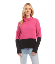 Load image into Gallery viewer, This cozy sweater helps keep out chilly weather and looks great with its hot pink and black colorblock design. Contrasting hem and sleeve detail create a sophisticated look. Color- Hot pink and black. Colorblock on hem and sleeves. Turtleneck. Ribbed detail. Fabric- 53% Recycled Polyester. 38% Acrylic. 7% Wool. 2% Spandex. Care- Dry clean.
