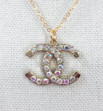 Load image into Gallery viewer, Stunning sparkle describes the Inocente vintage Coco Chanel zipper pull necklace.&nbsp; With a gold border and spectacular iridescent gemstones, this brilliant style&nbsp;will get you noticed and give you compliments.

