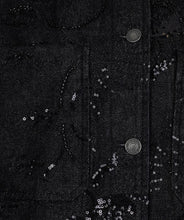 Load image into Gallery viewer, Close-up of sequins and silver buttons on a black jacket.
