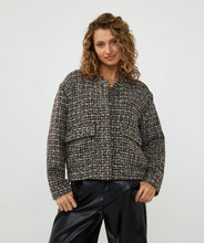 Load image into Gallery viewer, Introducing the EsQualo Tweed Bomber Jacket in black, a stylish and versatile piece featuring a subtle multicolor yarn and lurex. This jacket is the perfect combination of boldness and chic elegance, bringing a unique texture and shimmer to your wardrobe. Dress it up with a skirt or trouser or keep it casual with denim.
