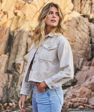 Load image into Gallery viewer, The EsQualo Jacket is a stylish blend of cool and elegant. Featuring frayed edges for a distressed denim look and delicate embroidery for a chic touch. This 100% cotton jacket includes front chest pockets for added functionality.
