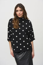 Load image into Gallery viewer, This pullover features a striking two-tone dotted pattern. Made from luxurious jacquard knit, it has an elegant funnel neck and three-quarter sleeves, each embellished with rhinestone buttons.
