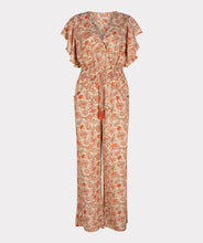 Load image into Gallery viewer, A breathtaking blend of orange, brown and red floral motifs on a pastel peach backdrop define the fashionable aura of the Tinslee jumpsuit. Delicate gold accents adorn the piece, accentuating the visual appeal of the design. For added drama, it features ruffled sleeves and an elasticized waist with tassels to give it a captivating, effortless style.  Color- Orange, brown, red, pastel peach, gold. One piece. Elasticized waist with tassels. V-neck. Ruffle sleeves. Fabric- 100% Polyester.

