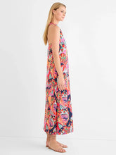 Load image into Gallery viewer, Woman wearing a bright red multicolor sleeveless dress against a white background.
