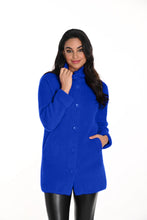 Load image into Gallery viewer, Woman wearing a blue coat and black leggings against a white background.
