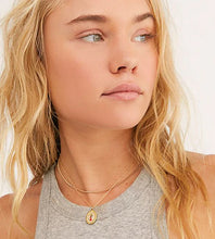 Load image into Gallery viewer, Woman wearing a gray tank and gold pendant necklace.
