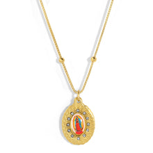 Load image into Gallery viewer, Gold necklace with a religious pendant against a white background.
