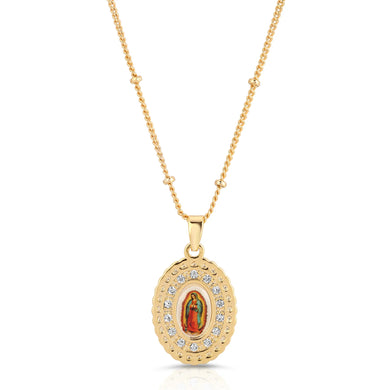 Gold necklace with a pendant featuring Our Lady of Guadalupe icon on a white background surrounded by crystals against a white background.