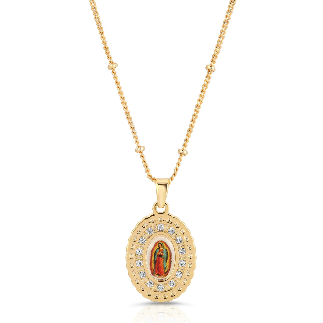 Gold necklace with a pendant featuring Our Lady of Guadalupe icon on a white background surrounded by crystals against a white background.