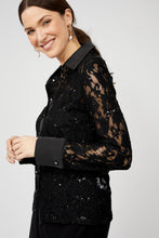 Load image into Gallery viewer, Woman wearing a black lace top with sequins against a white background.
