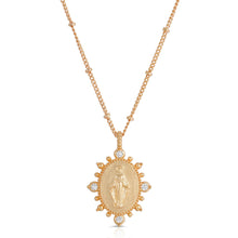 Load image into Gallery viewer, Deepen the faith with the Lady Lourdes Pendant Necklace. Features a golden metallic pendant, highlighting a portrait of the Virgin Mary surrounded by ornamental CZ accents and embellished spike details.   Color- Gold and clear. Cubic zirconia. 14K Yellow gold plating over brass. 14&quot; chain length + 4&quot; extender.
