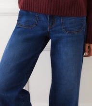 Load image into Gallery viewer, Close up of model wearing blue jeans with patch pockets and burgundy sweater against a white background.

