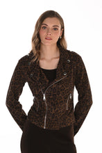 Load image into Gallery viewer, A woman modeling a moto brown and black leopard-print acket with silver zippers and snap details, worn over a black top and black pants against a plain white background.
