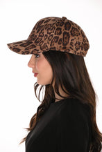 Load image into Gallery viewer, A woman in profile wearing a brown and black leopard print baseball cap, photographed against a plain white background.
