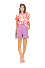 Load image into Gallery viewer, These delightful shorts feature a lovely lilac color that will go with many different spring/summer tops in your wardrobe.  A rich fabrication on our Lily gives this short a classy look while still keeping you cool during the heat of the summer.    Color - Lilac. Back zipper closure. Front functional pockets. Back pockets non-functional. Two non-functional button detailing on upper band of short.  Fabric - 100% Polyester.
