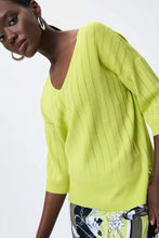 Load image into Gallery viewer, All eyes are on this striking lime green top designed by Joseph Ribkoff. Made from a lightweight summer sweater knit, our Lydia top offers a touchable texture that is super soft against the skin. A v split on each side is enhanced with silver rivet accents, while the V-neck design allows you to show off your favorite jewelry pieces.  Color - Lime 3/4 Sleeve. Lightweight sweater knit.
