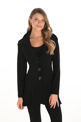 Woman wearing a long black jacket with jewel buttons against a white background.