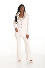 Load image into Gallery viewer, Woman wearing an off-white long jacket and off-white wide leg pants and off-white heels against a white background.
