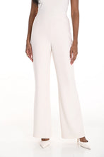 Load image into Gallery viewer, Close-up photo of woman wearing off-white wide leg pants and off-white heels against a white background.
