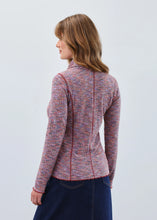 Load image into Gallery viewer, Woman wearing a spacedye long-sleeve, turtleneck top and denim skirt against a white background.
