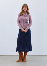 Load image into Gallery viewer, Woman wearing a spacedye long-sleeve, turtleneck top, denim skirt  and brown boots against a white background.
