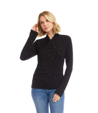 Load image into Gallery viewer, Woman wearing a black long-sleeve crossover top with sparkles and jeans against a white background.
