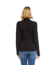 Load image into Gallery viewer, Woman wearing a black long-sleeve crossover top with sparkles and jeans against a white background.
