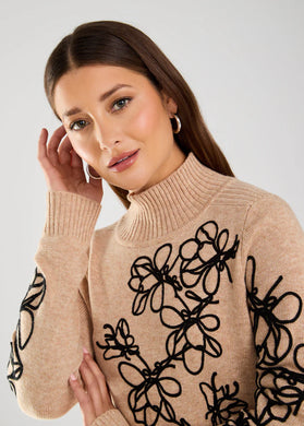 This faux-cashmere sweater features embroidered florals and offers a delicate texture and elegant appearance, suitable for all occasions. It pairs beautifully with black skirts or pants and also looks perfect when styled with denim.