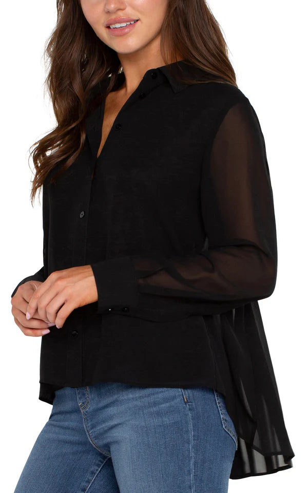 Our chiffon button-front blouse offers versatile elegance, easily transitioning from casual to formal. The back pleat detail adds a touch of sophistication, making it an essential addition to your cool weather collection.