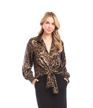 Load image into Gallery viewer, Woman wearing a leopard print blouse and black skirt against a white background.
