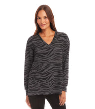 Load image into Gallery viewer, Experience ultimate comfort and warmth in our cozy zebra print long sleeve v-neck sweatshirt. Perfect for both leisurely days and cooler weather, this top pairs effortlessly with leggings or denim for a casual yet stylish look.
