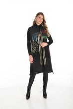 Load image into Gallery viewer, Woman wearing a black vest with abstract design, black long sleeve top, black leggings and black boots against a white background.
