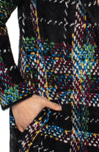 Load image into Gallery viewer, Close-up of a multicolored patterned coatigan with a hand in the pocket.
