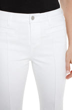 Load image into Gallery viewer, Close-up of model wearing white denim bootcut jeans with welt pockets, wand black top against a white background.
