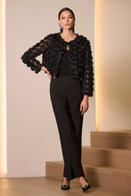 Load image into Gallery viewer, Woman wearing a black lace jacket over a black top, black lux pants and black heels in a softly lit room.
